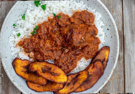 Curried Chicken Ghanaian Style With Rice And Fried Plantain